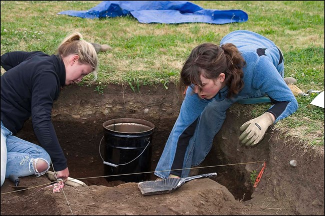 Archeologists excavating Archeologists excavating