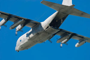 A large airplane flying in a blue sky. A large airplane flying in a blue sky.