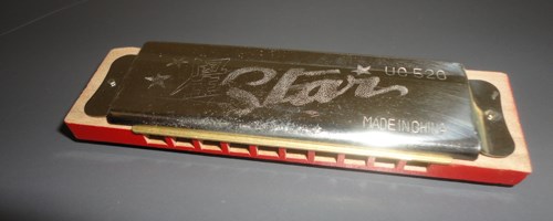 Red and gold harmonica