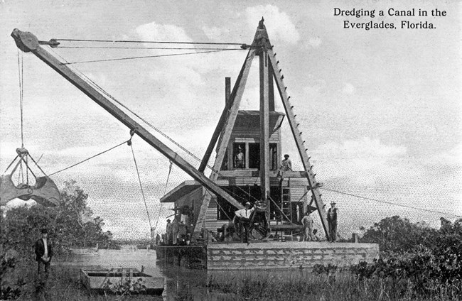 A bucket dredger photographed in the 1910s