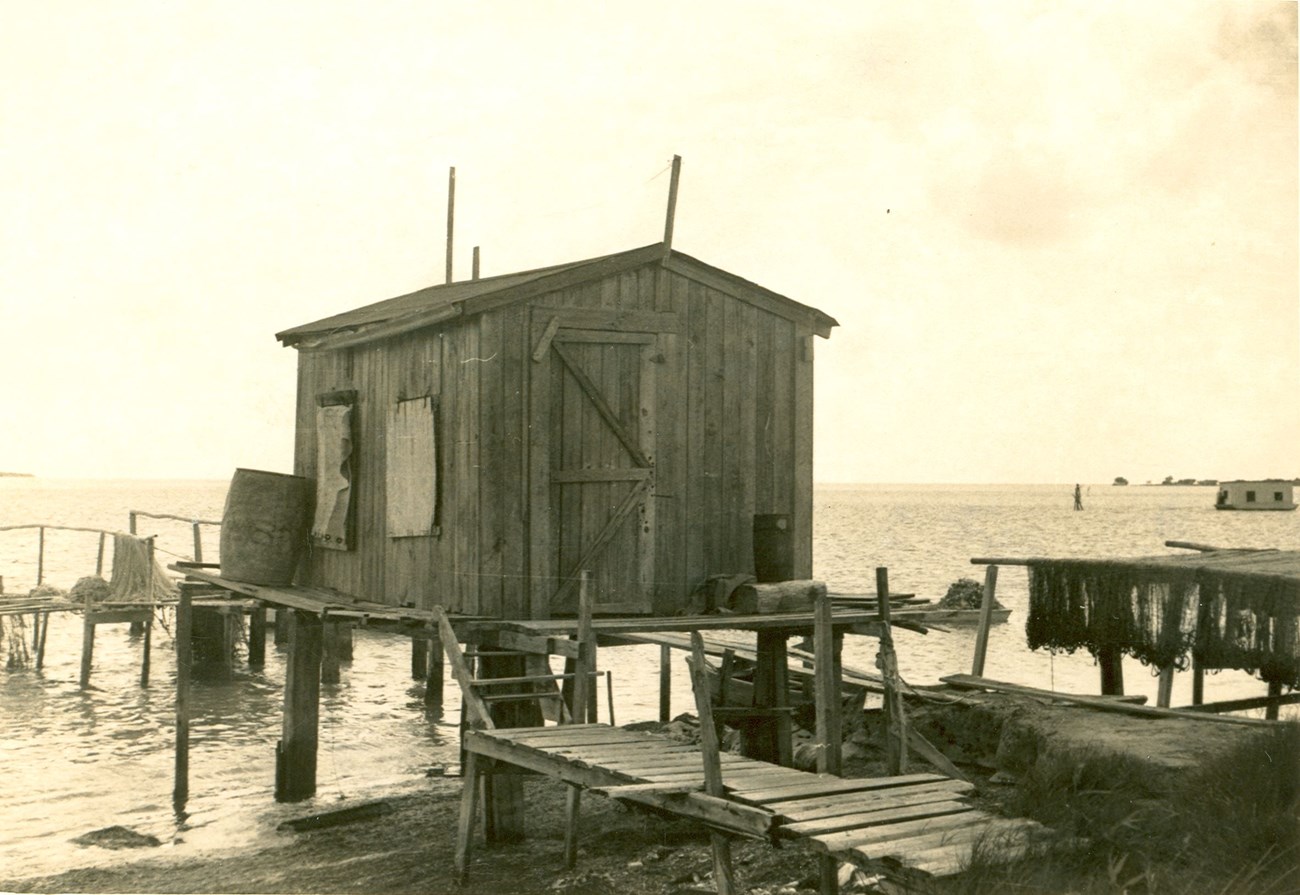 House on water with Boathouse