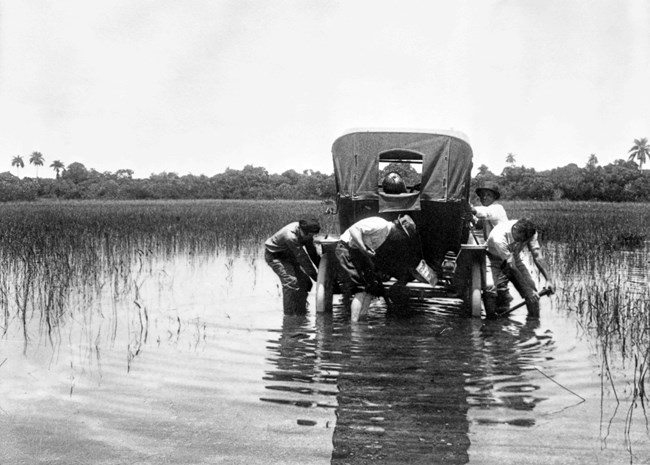 Old car stuck in deep water