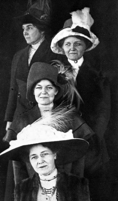 Group of women wearing plumed hats in the 1890s