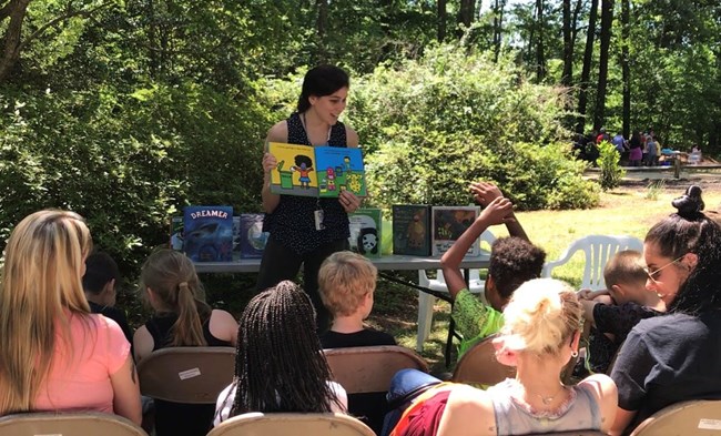 Story time A Librarian presenting a book to the classroom