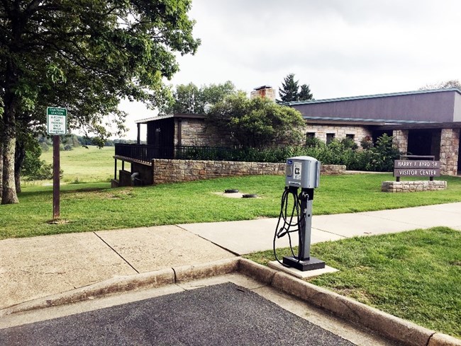 Electric Vehicle charger installed in parking area near visitor center