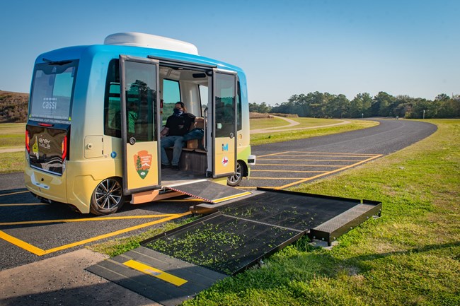 Wheelchair Accessible Autonomous Vehicle on a park road Wheelchair Accessible Autonomous Vehicle on a park road