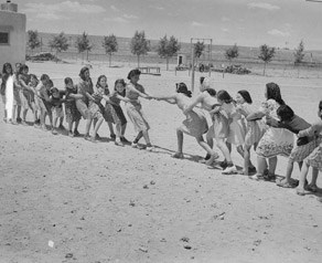 Girls at Isleta Day School in a tug of war, Albuquerque, New Mexico, 1940.