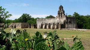 Mission San Juan Capistrano with prickly pear in the foreground.