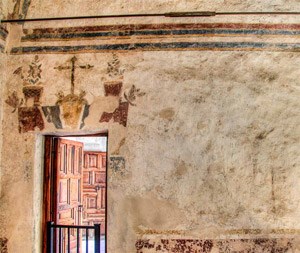 Restored paint and plaster over an interior door.