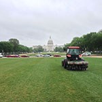 a red tractor in front of the US capitol building
