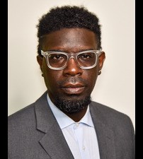 dann j broyld black man with glasses and afro