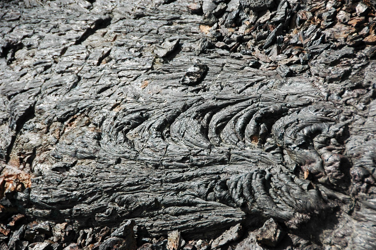 detail photo of ropy lava surface within a lava flow