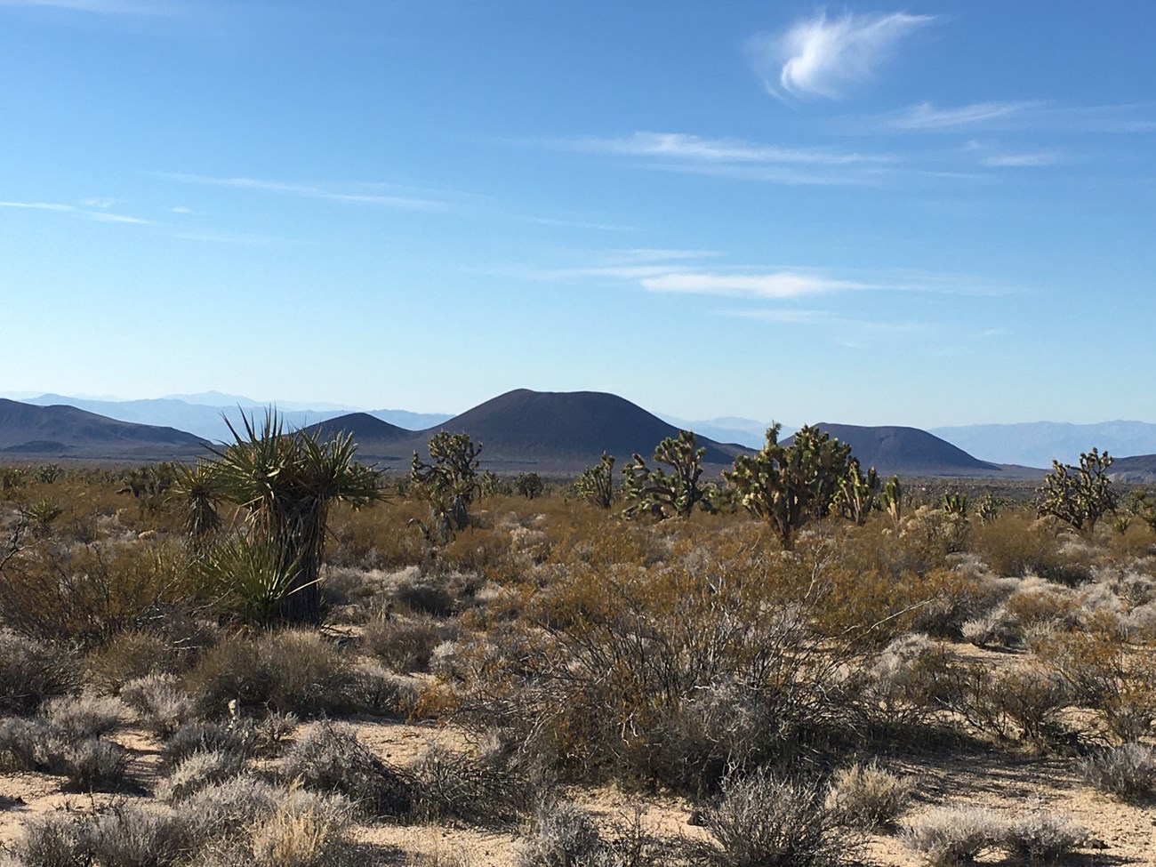 3 cinder cones in a desert landscape