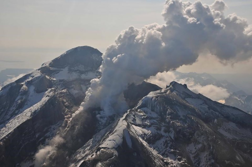Redoubt Volcano in Lake Clark National Park 2009 steam cloud rises from an erupting mountaintop crater