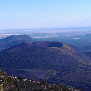 Photo of a cinder cone an several volcanic buttes