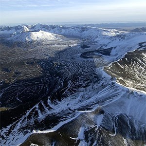photo aerial view of caldera rim and cones