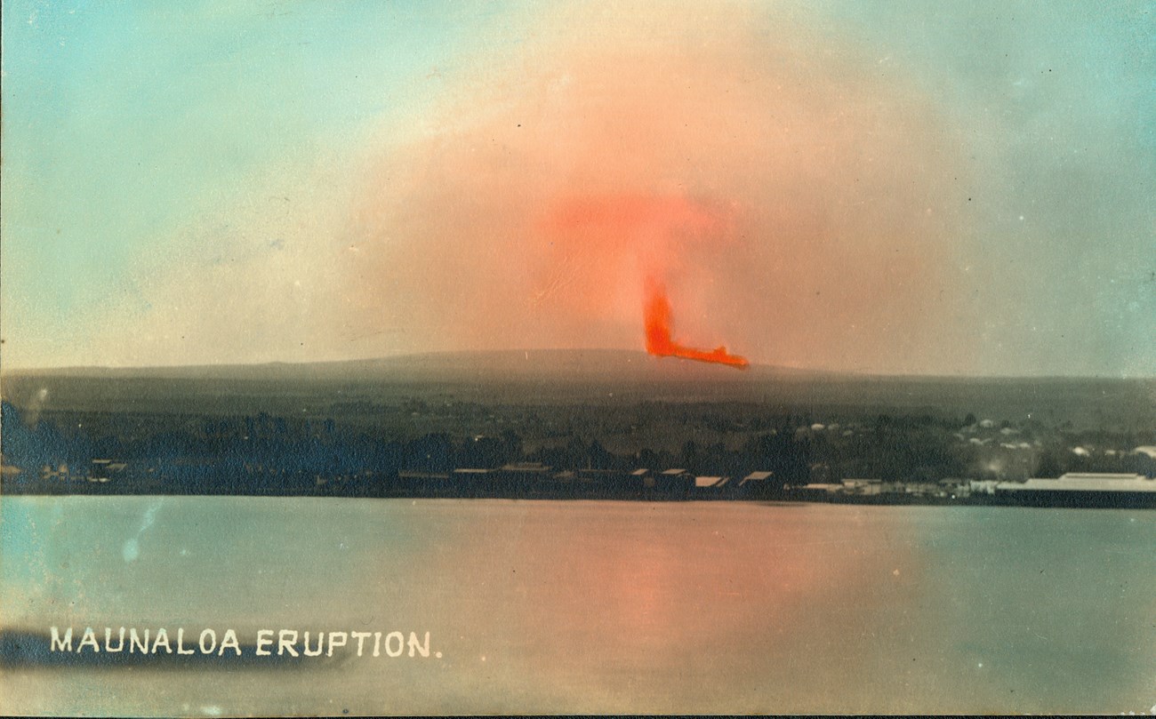 Historic colorized postcard of an erupting volcano