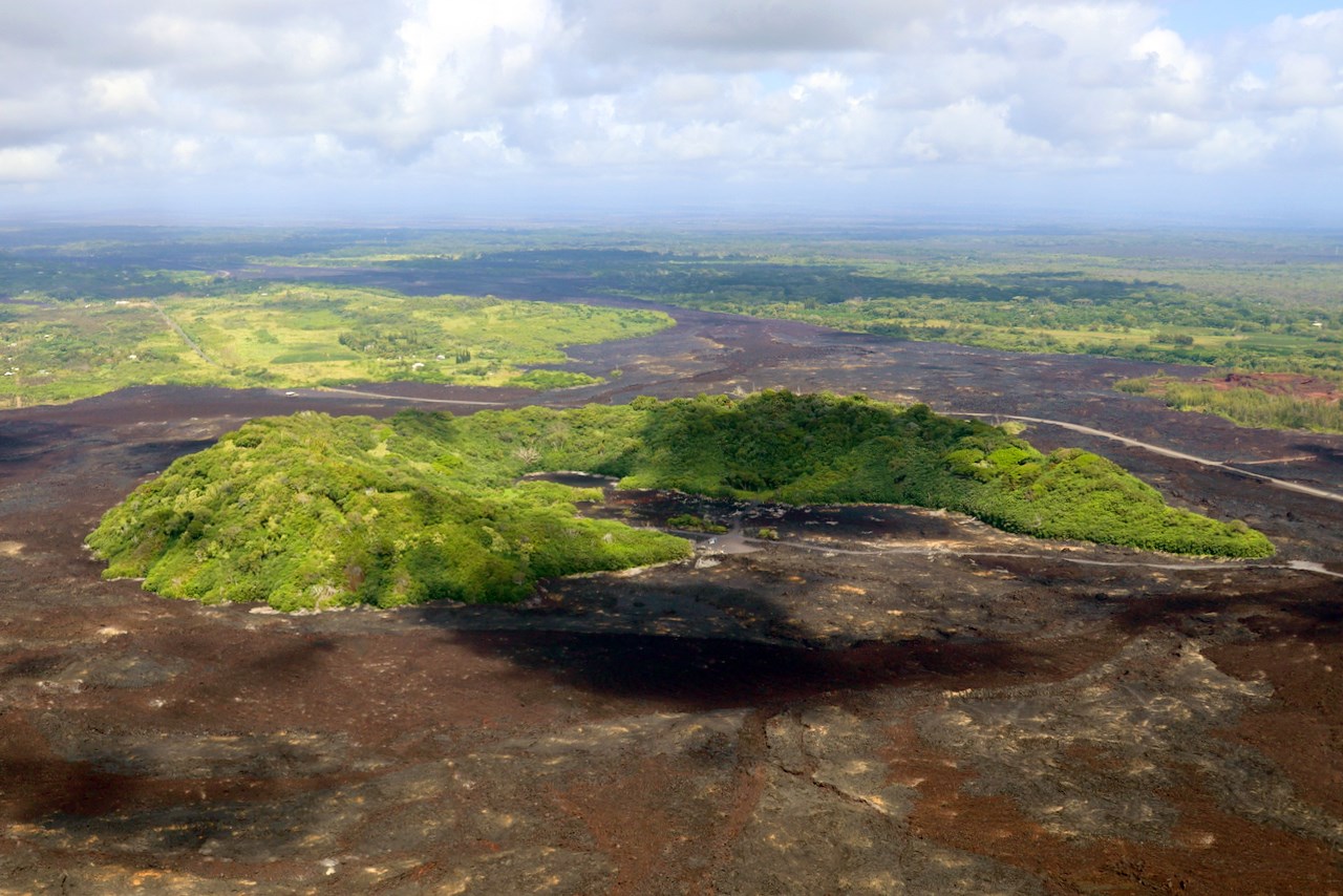 multimediaFile-3566 Photo of areas of barren lava flows surrounding islands of older vegetation.