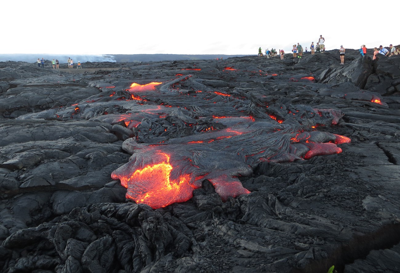 photo of lava flow with molten rock
