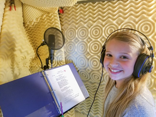 Katelyn recording Lotty-134238 Katelyn Joseph reading Lotty for the Magic Sash. PRX Photo