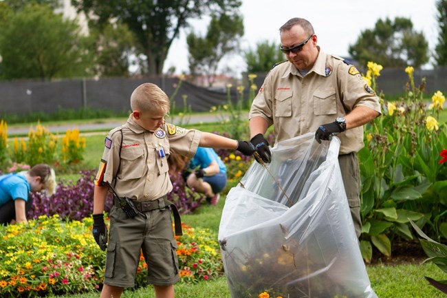 Scout Ranger and troop leader clean up park. Scout Ranger and troop leader clean up park.