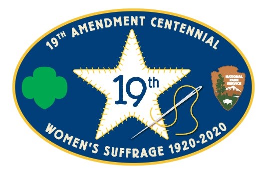 An illustration of a blue oval-shaped patch with a white star and NPS and Girl Scouts logos; word read: "19th Amendment Centennial, Women's Suffrage 1920-2020".