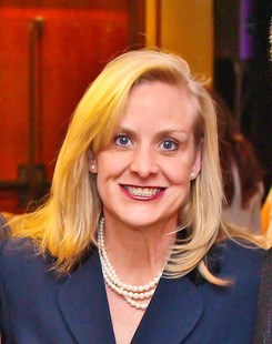 A woman smiling indoors