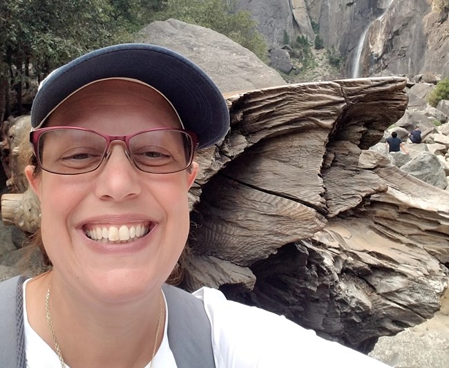 Patricia smiling in front of falls