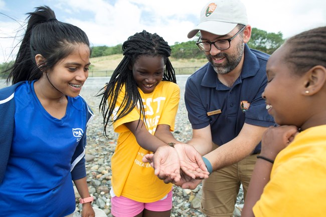 YMCA members explore with a park ranger.