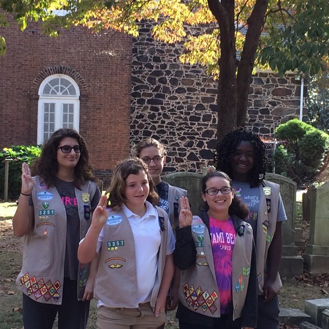 gsrpledge Girl Scouts pose for photo.
