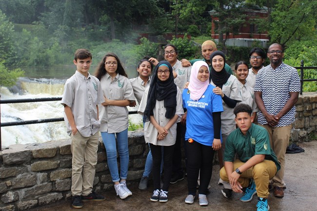 A group of corps members pose for a photo.