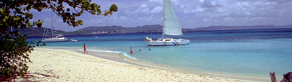 Sailboat on a white sand beach