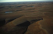 The limestone and shale sediments seen in the Flint Hills today show us a cross section of a landscape that looked much different long ago. The limestone and shale sediments seen in the Flint Hills today show us a cross section of a landscape that looked much different long ago.