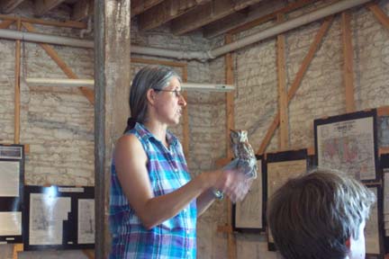 Naturalist providing bird program with live bird