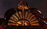 Detail of the carved sun with liberty pole and cap on the crest rail of the Speaker