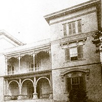 The Towers three-story house featuring ornate ironwork