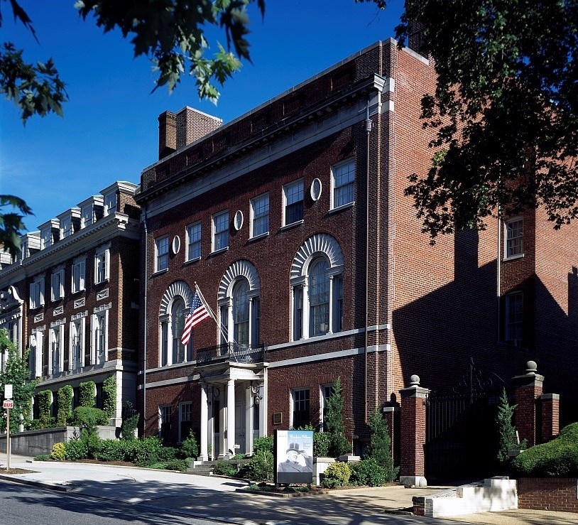 Front of Woodrow Wilson house, made of brick, with street in foreground. Front of Woodrow Wilson house, made of brick, with street in foreground.