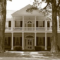 Linden two-story house with first and second story porches