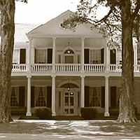 two-story house with first and second story porches