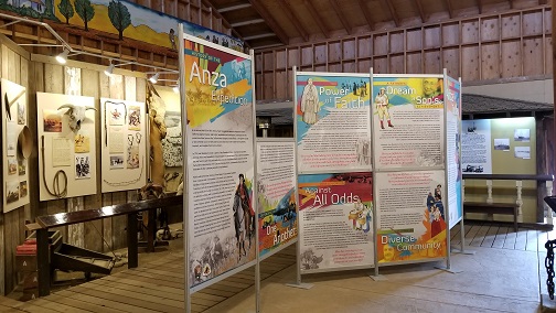 Traveling Exhibit King City Indoor museum with artifacts on the wall and a standing exhibit