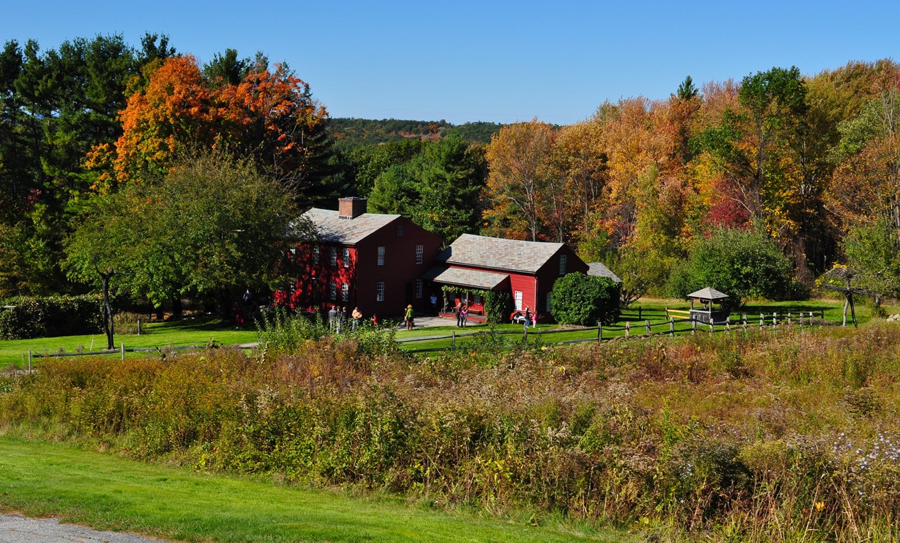 red clapboard building in a rural setting