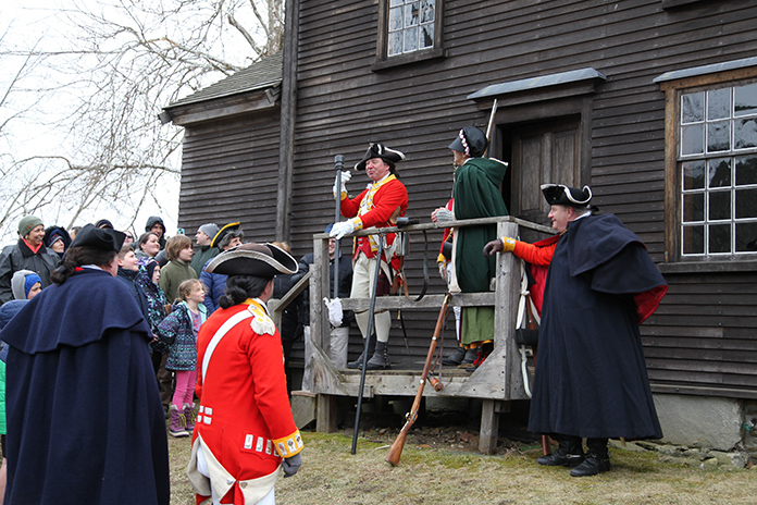 British soldiers stand at the back of the Barrett Farm House British soldiers stand at the back of the Barrett Farm House