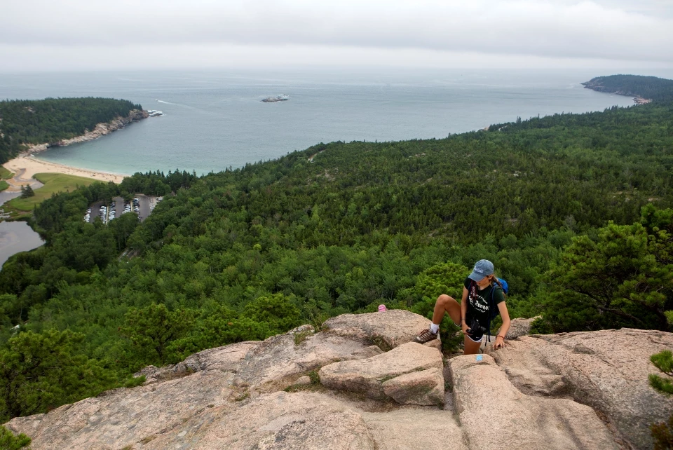 Beehive summit view view of ocean and a climber reaching the summit