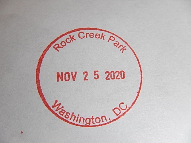 Circular Passport Stamp with Rock Creek Park across top of circle, Washington, DC across bottom and a date across the diameter