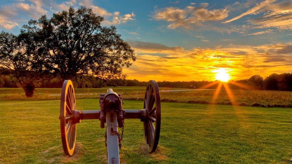 A cannon in a battlefield at sunset. A cannon in a battlefield at sunset.