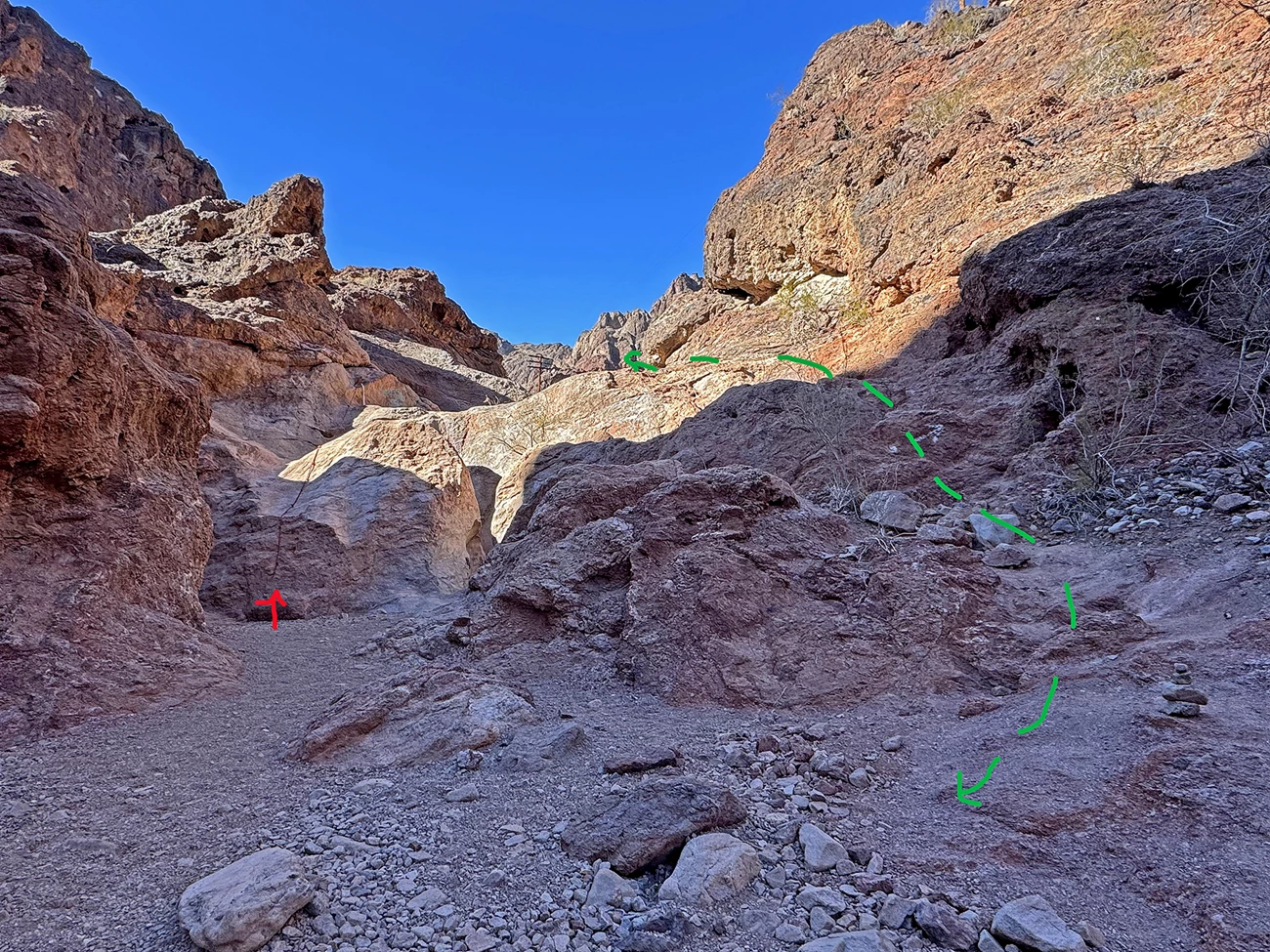 Image shows a dry waterfall in Goldstrike canyon with a rope to hand climb up the almost vertical rockface at least 10 feet. Gold Strike Trail Rope Climb