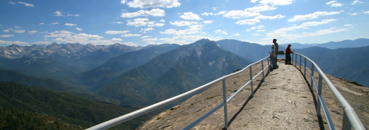 People admire views from within the narrow railing at the top of Moro Rock. Photo courtesy of Paul Johnson.