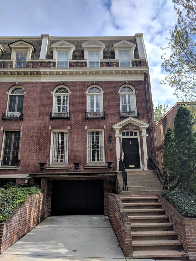 Photograph of Frances Perkins house, made of brick, circa 2018.