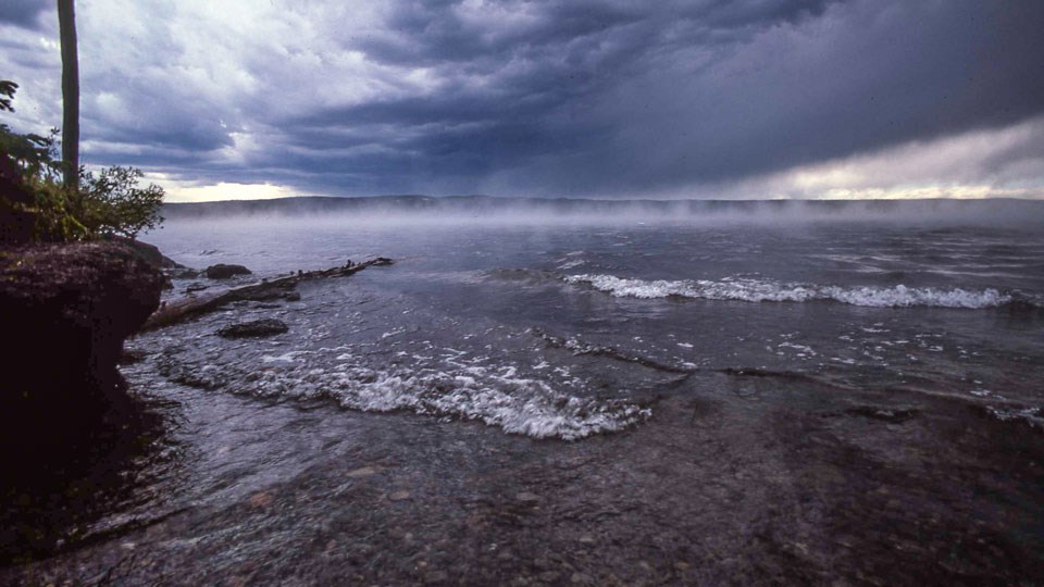 Lewis Lake Water crashes on the rocky shore of Lewis Lake.