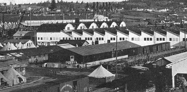 A black and white photo of an aerial view showing several buildings at the Spruce Mill including the Machine Shop.